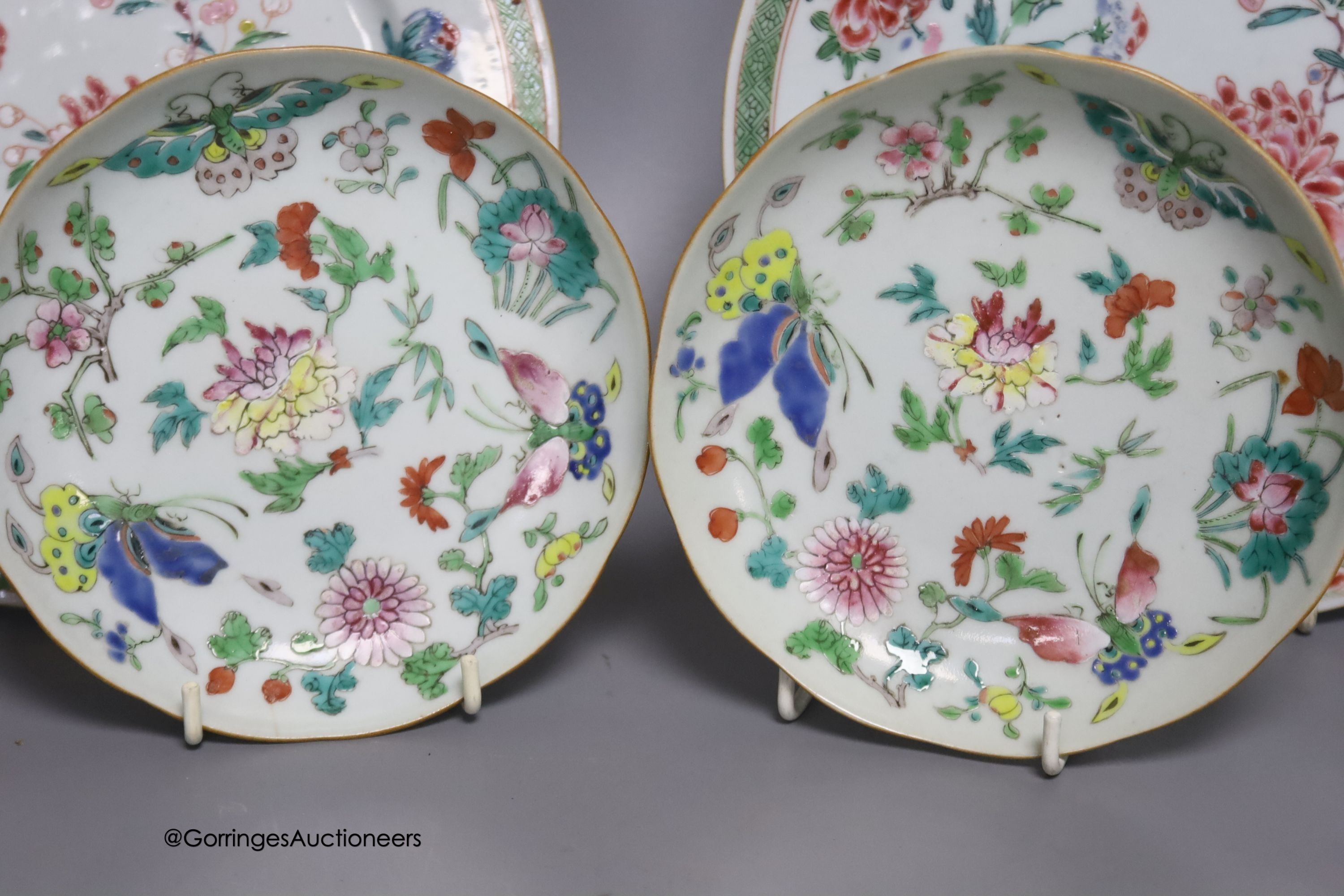 A 19th century Chinese famille rose bowl, two saucers and two 18th century Chinese famille rose plates 23cm